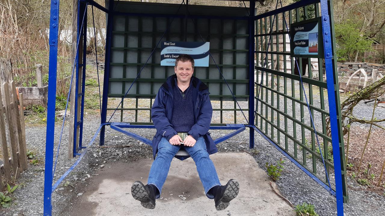 A wind powered chair that moves up and down.